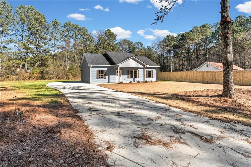 146 Old Brock Road Rockmart, GA 30153 - Photo 6 of 45 a front view of a house with a yard and garage