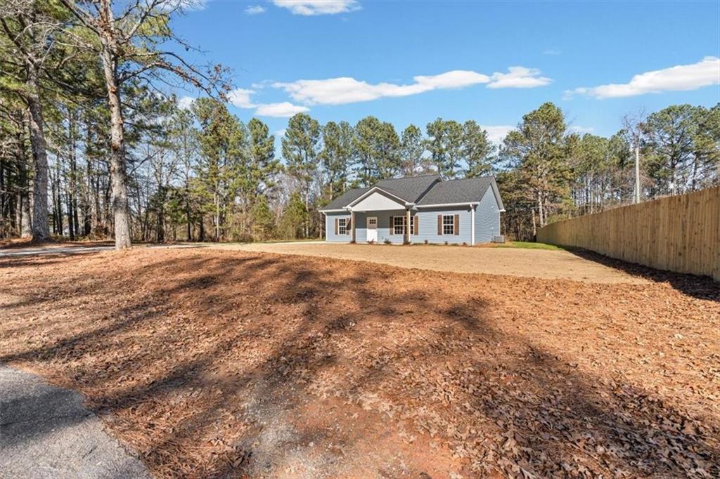 146 Old Brock Road Rockmart, GA 30153 - Photo 7 of 45 a front view of a house with a yard