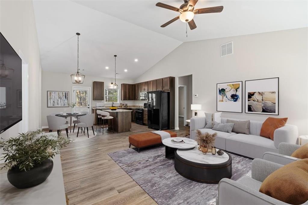 146 Old Brock Road Rockmart, GA 30153 - Photo 9 of 45 a living room with furniture and a chandelier