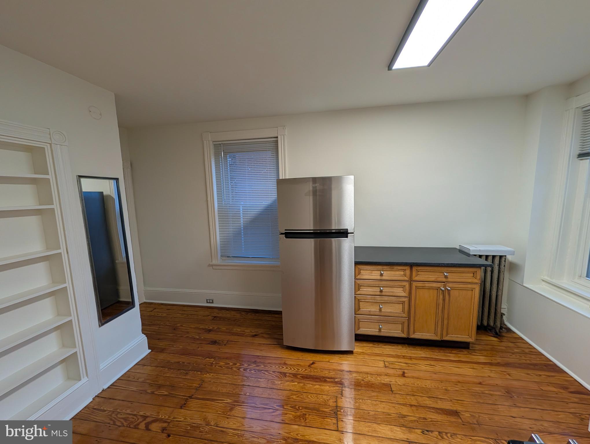 105 West 3rd Avenue, Unit 2 Conshohocken, PA 19428 - Photo 18 of 18 a view of a refrigerator in kitchen and an empty room