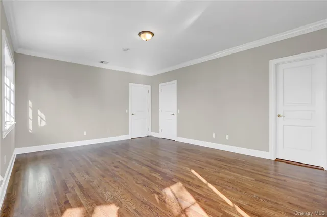 a view of an empty room with a fireplace