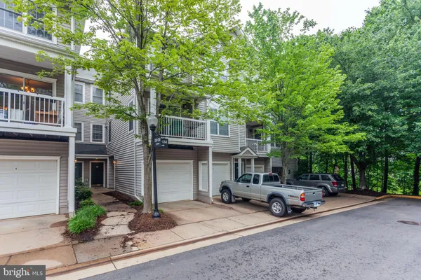 a view of a car park in front of house