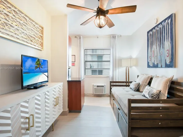 a bedroom with furniture and a chandelier