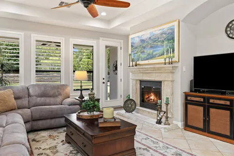 a living room with furniture and a fireplace