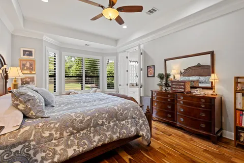 a bedroom with a large bed and a large window