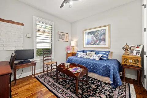 a bedroom with bed and window