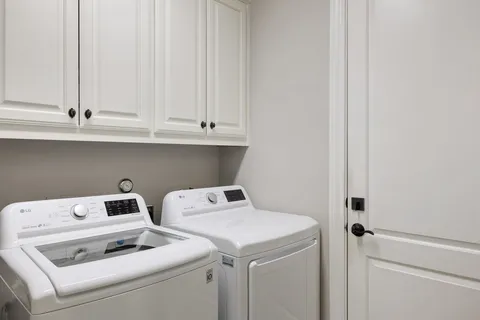 a view of backyard with swimming pool and furniture
