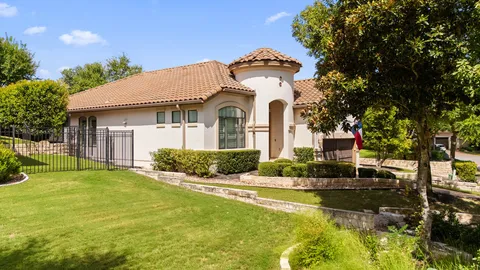 a aerial view of a house with a yard