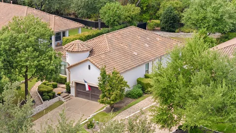 a view of house with yard and sitting area