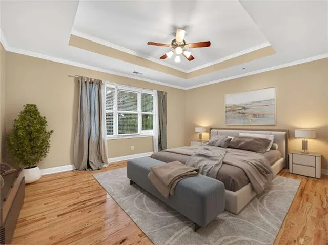 a spacious bedroom with a large bed and a window