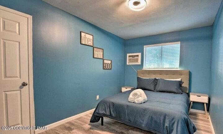 479 Mountain Road Albrightsville, PA 18210 - Photo 15 of 30 a bedroom with a bed and window