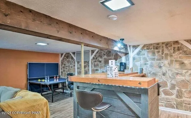 a room with furniture a rug and a chandelier