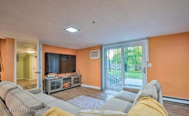 a living room with furniture and a flat screen tv