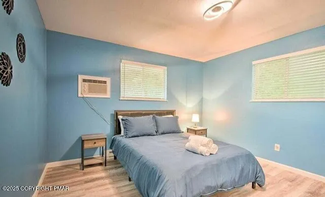 a bedroom with a bed and window