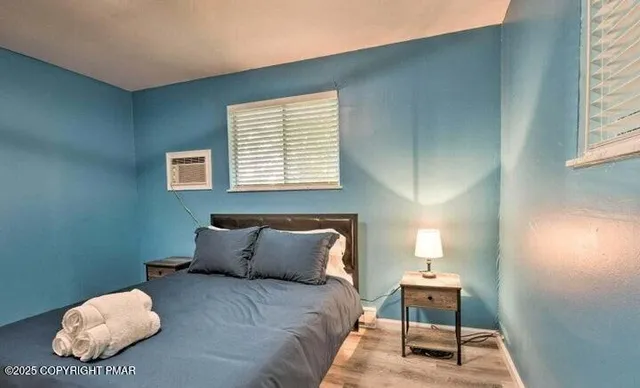 a bedroom with a bed and a window