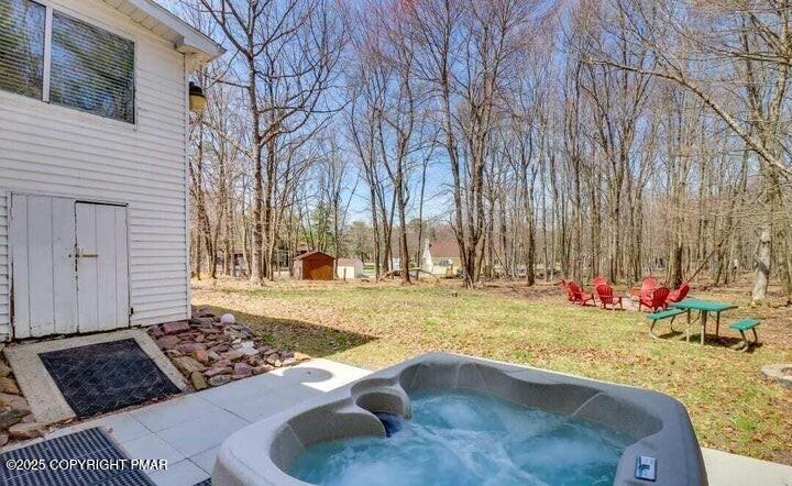 479 Mountain Road Albrightsville, PA 18210 - Photo 7 of 30 a view of a backyard with a table and chair