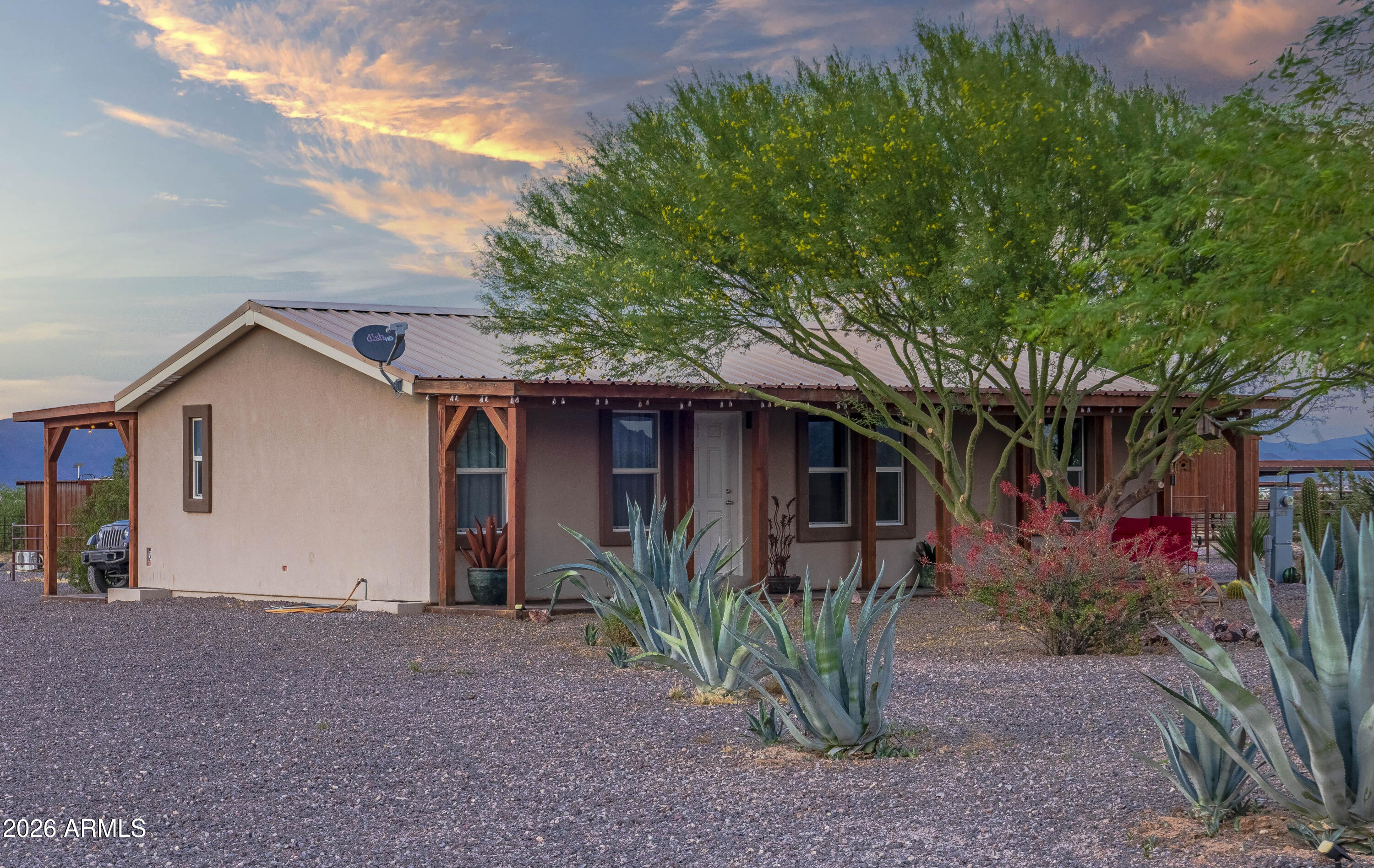 52510 Williams Road Aguila, AZ 85320 - Photo 11 of 62 a view of a house with a yard and plants