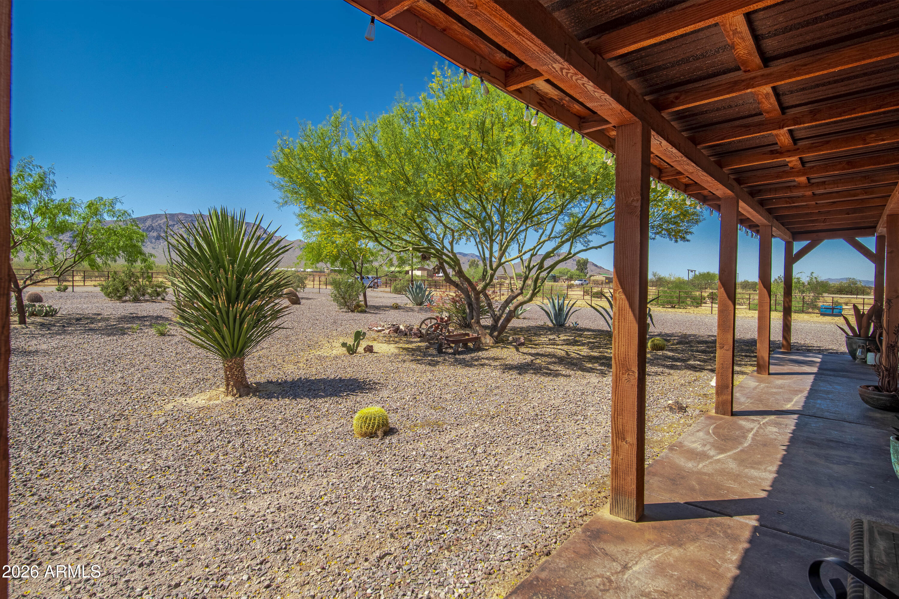 52510 Williams Road Aguila, AZ 85320 - Photo 13 of 62 a view of a backyard space with potted plants