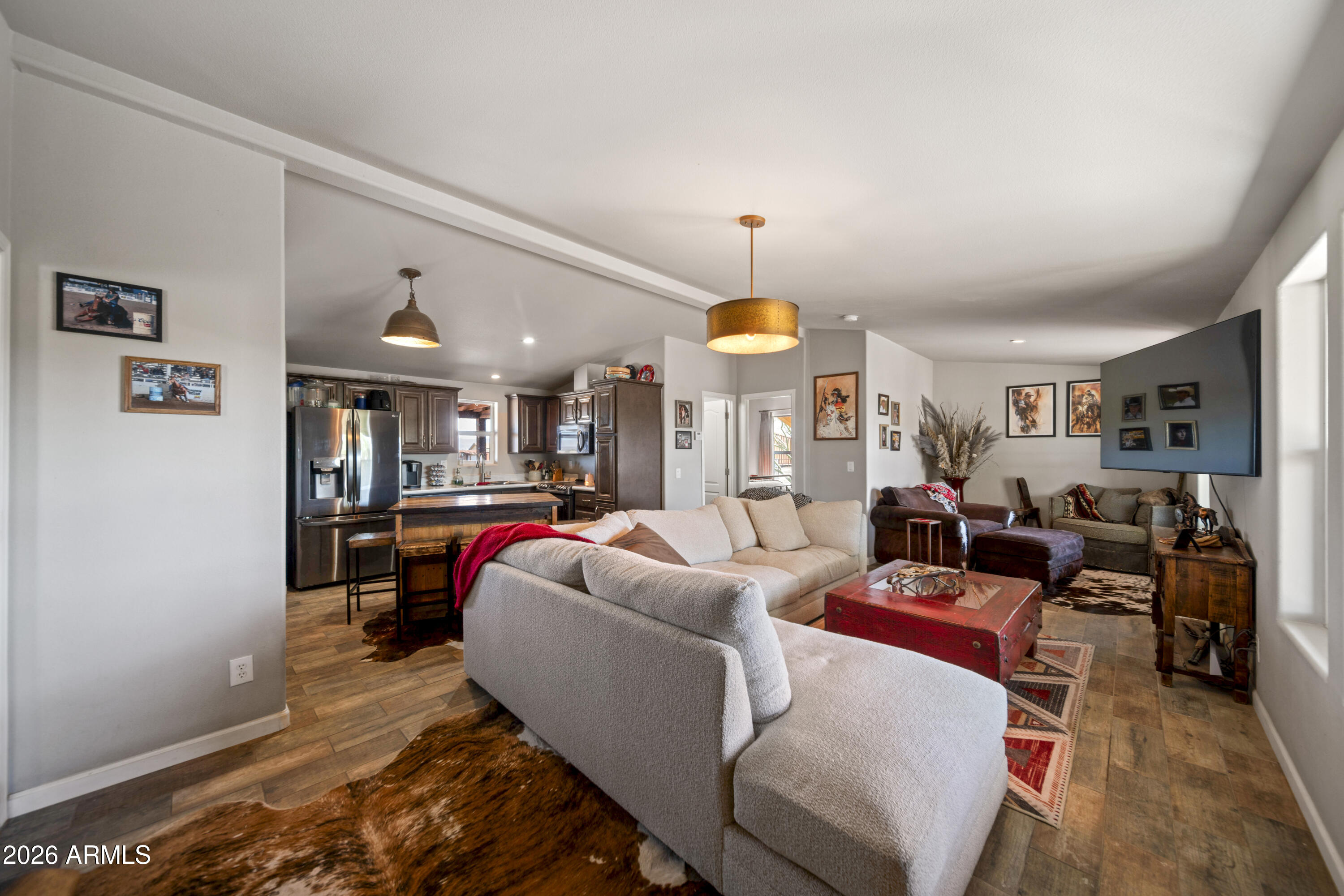 52510 Williams Road Aguila, AZ 85320 - Photo 16 of 62 a living room with furniture and a wooden floor