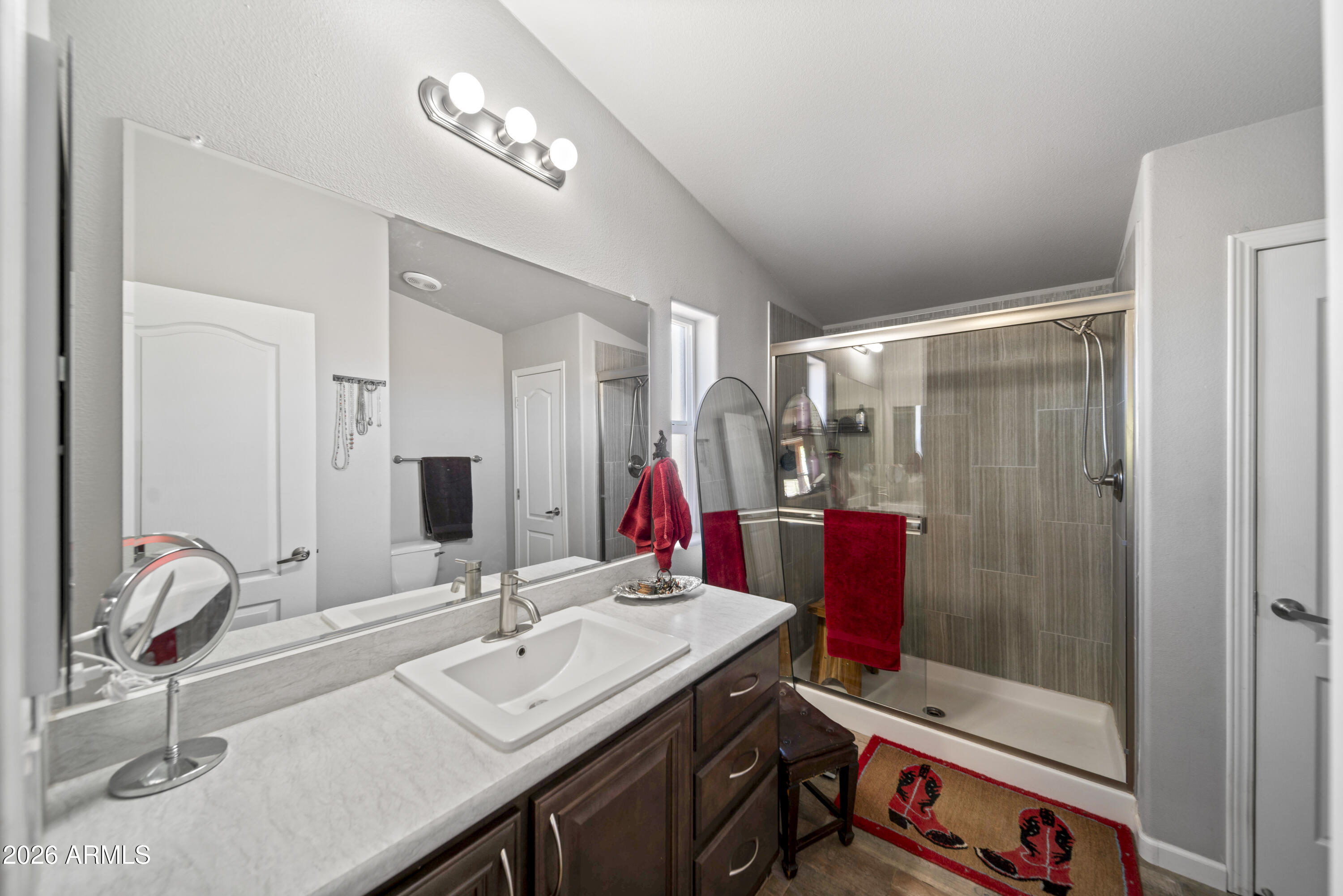 52510 Williams Road Aguila, AZ 85320 - Photo 18 of 62 a bathroom with a sink and a mirror