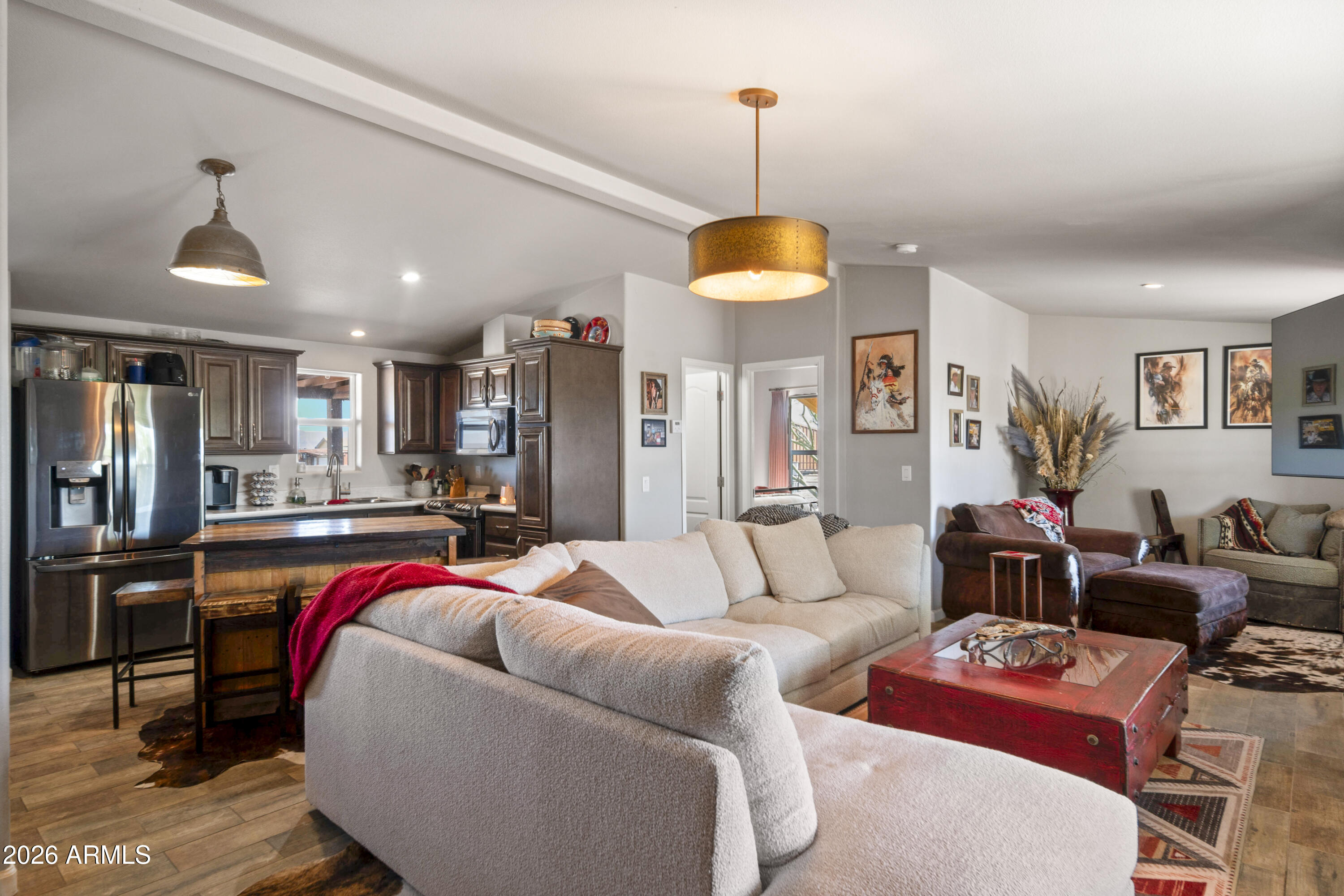 52510 Williams Road Aguila, AZ 85320 - Photo 19 of 62 a living room with furniture kitchen and a chandelier
