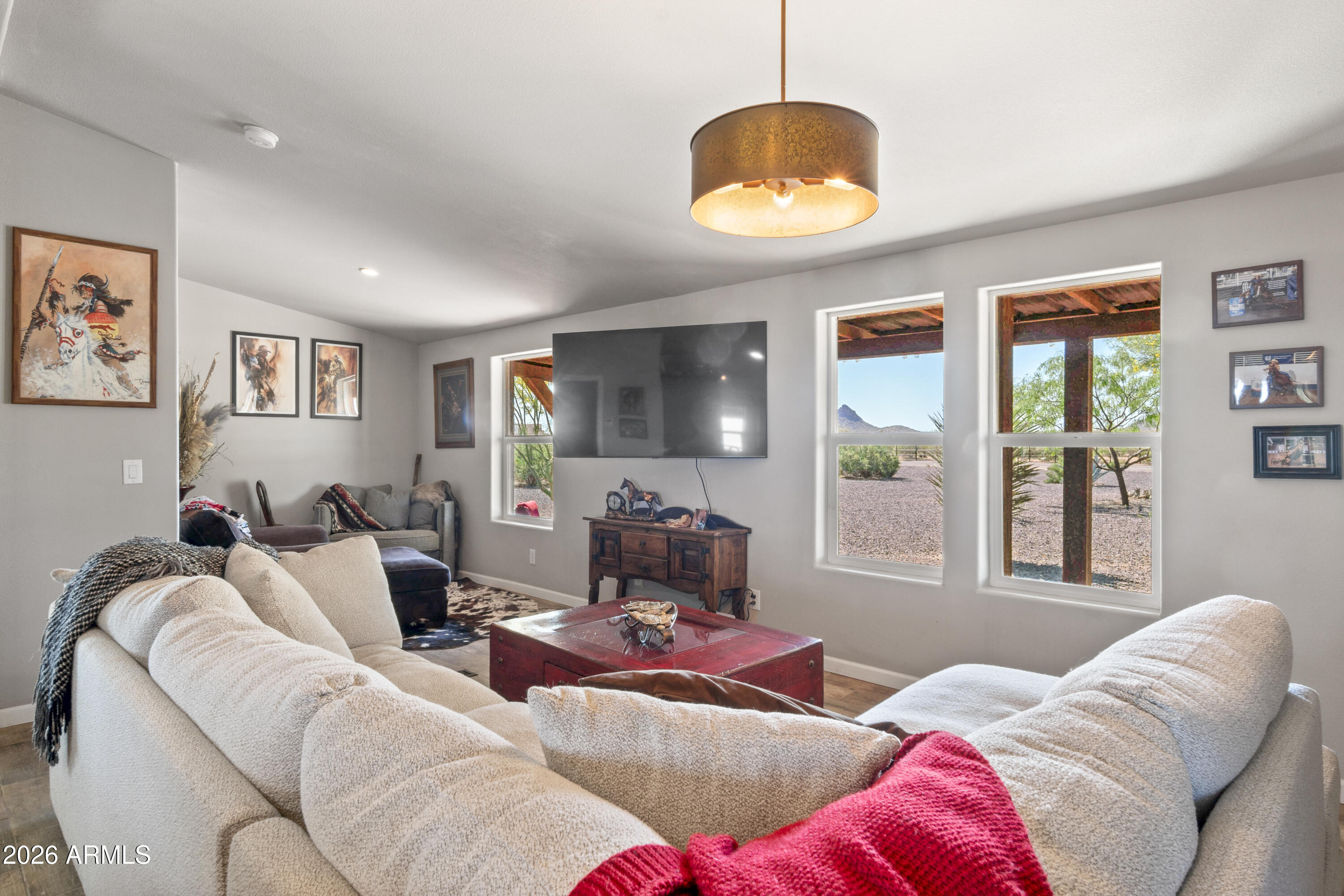 52510 Williams Road Aguila, AZ 85320 - Photo 20 of 62 a living room with furniture and a large window
