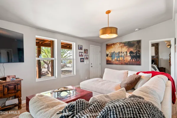 a bed room with a bed and a chair