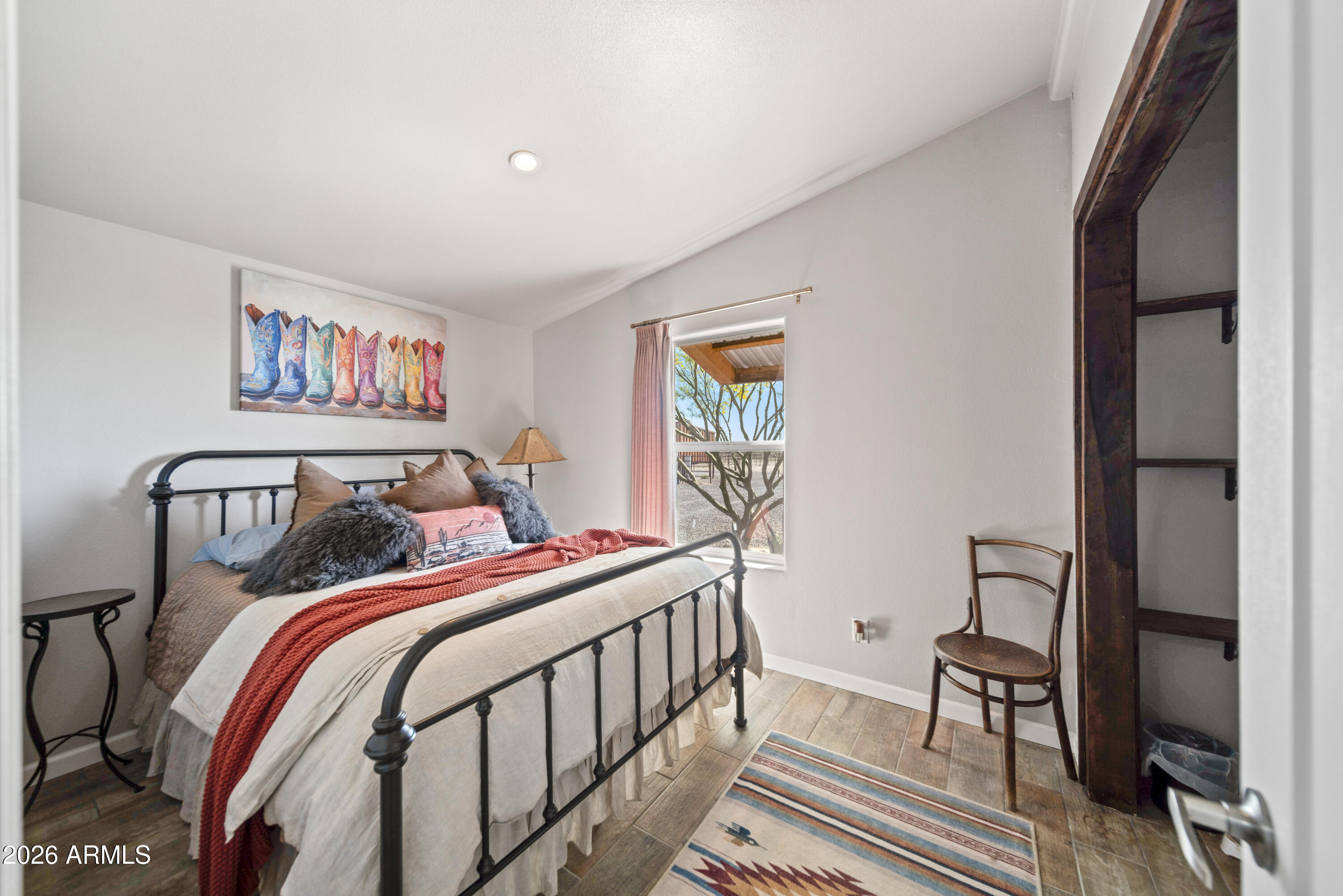 52510 Williams Road Aguila, AZ 85320 - Photo 29 of 62 a bedroom with a bed and a painting on the wall