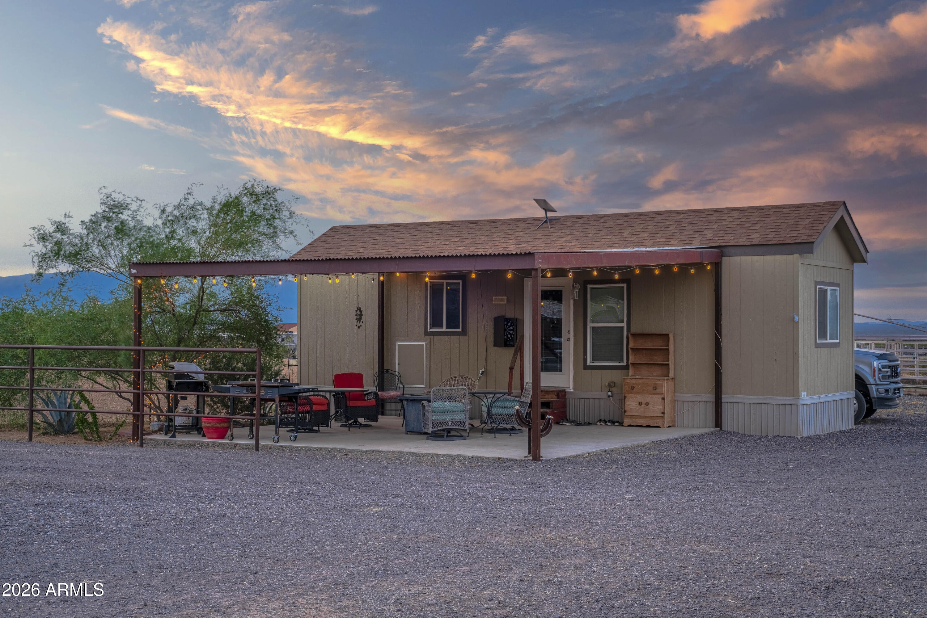 52510 Williams Road Aguila, AZ 85320 - Photo 31 of 62 a view of a house with sitting area and garden