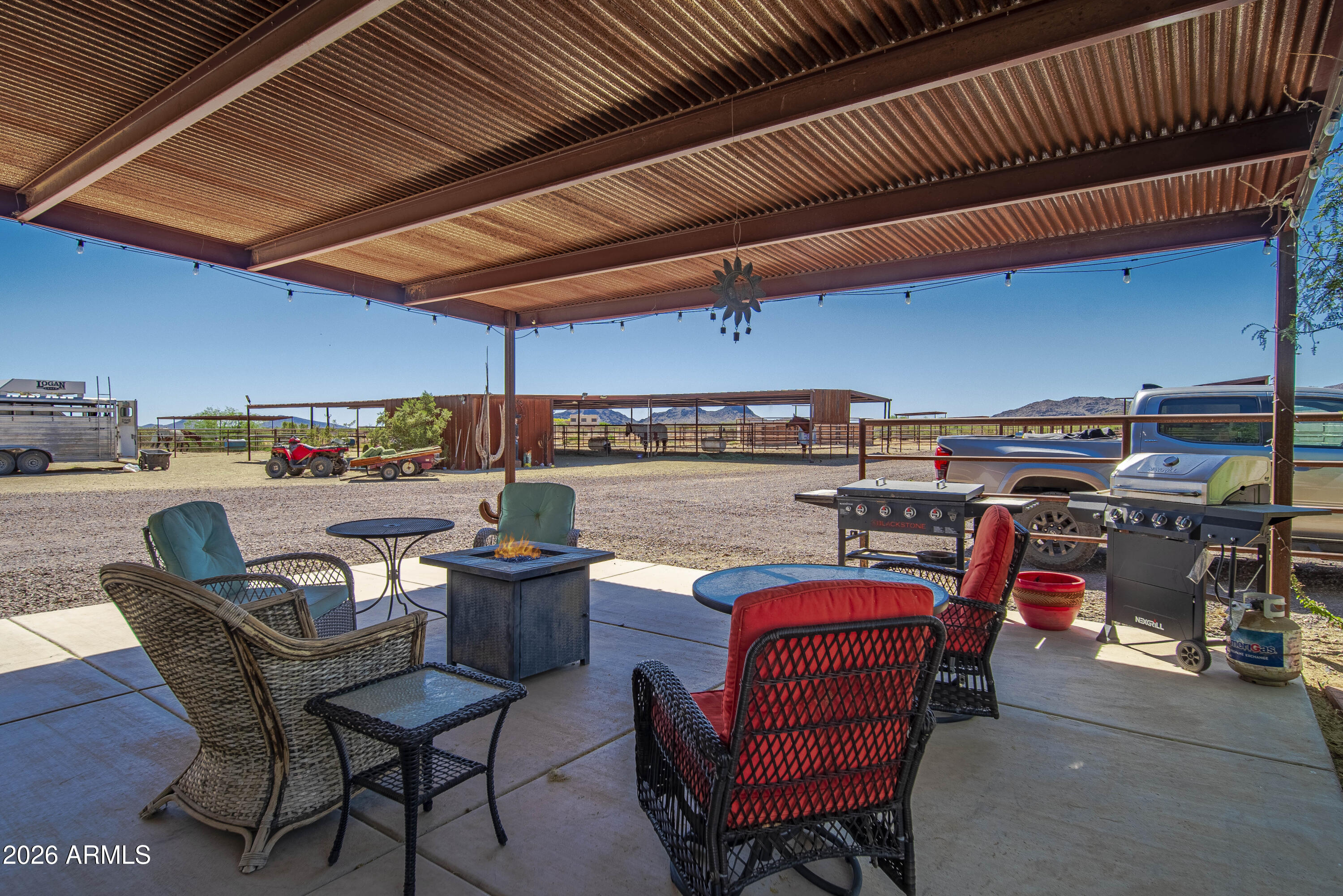 52510 Williams Road Aguila, AZ 85320 - Photo 32 of 62 a view of a chairs and tables in patio