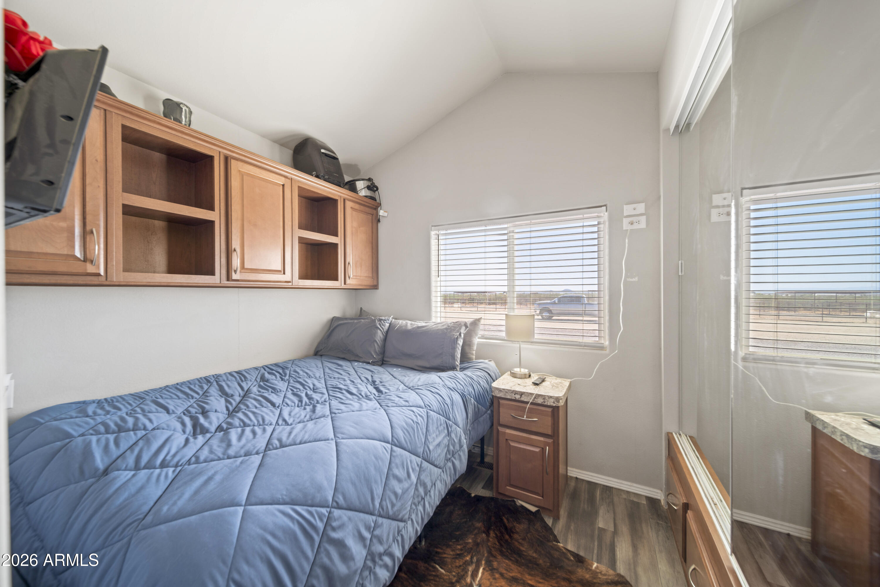 52510 Williams Road Aguila, AZ 85320 - Photo 35 of 62 a bedroom with a bed and wooden floor