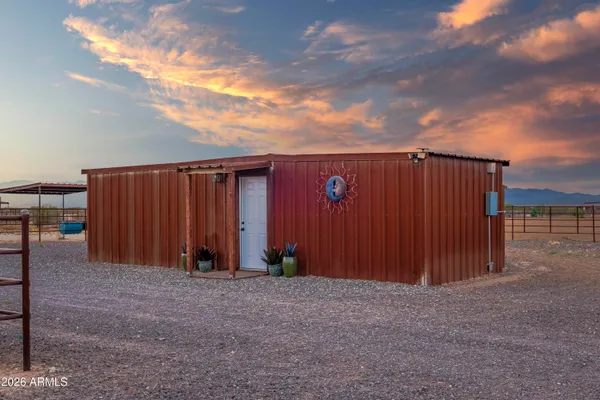 a view of a terrace with a table and a chairs