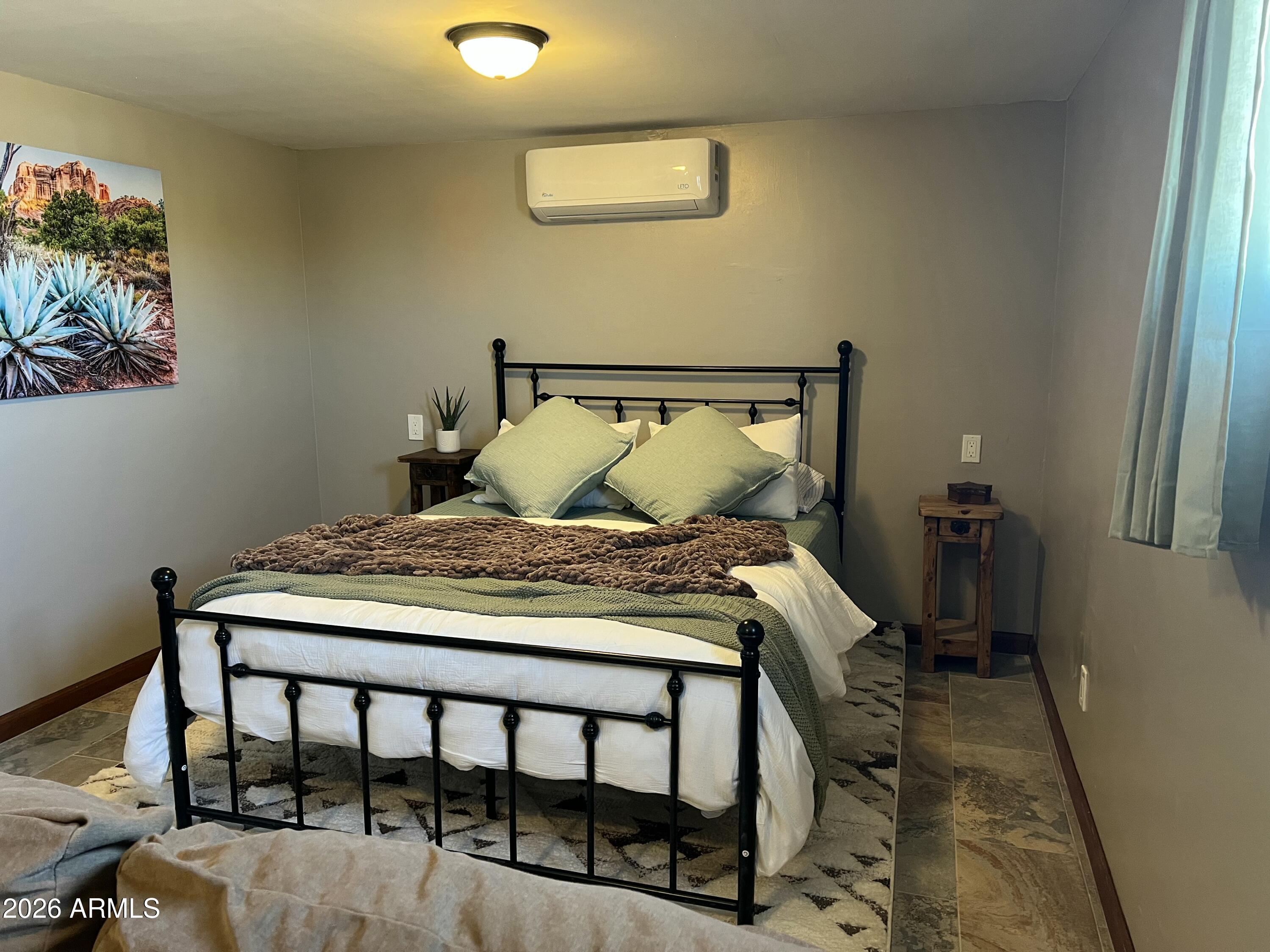 52510 Williams Road Aguila, AZ 85320 - Photo 39 of 62 a bedroom with a bed and a window