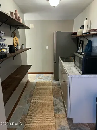 a view of a house with a yard and a tub