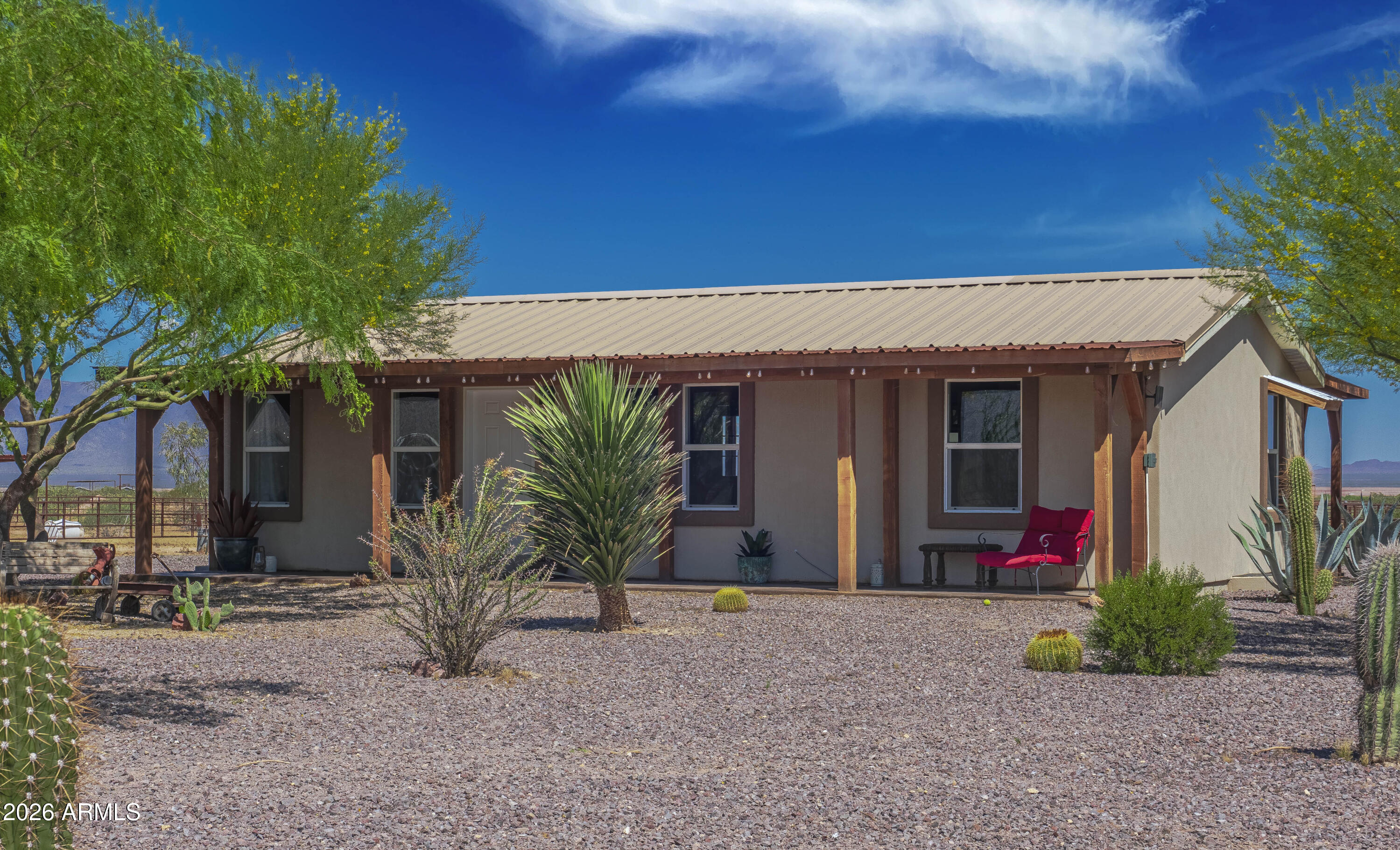52510 Williams Road Aguila, AZ 85320 - Photo 9 of 62 a front view of a house with garden