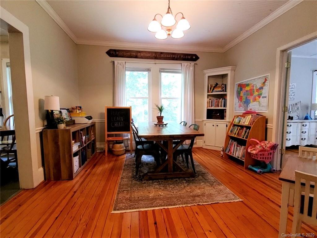 1602 Griffith Road Monroe, NC 28112 - Photo 16 of 45 a view of a dining room with furniture window and wooden floor