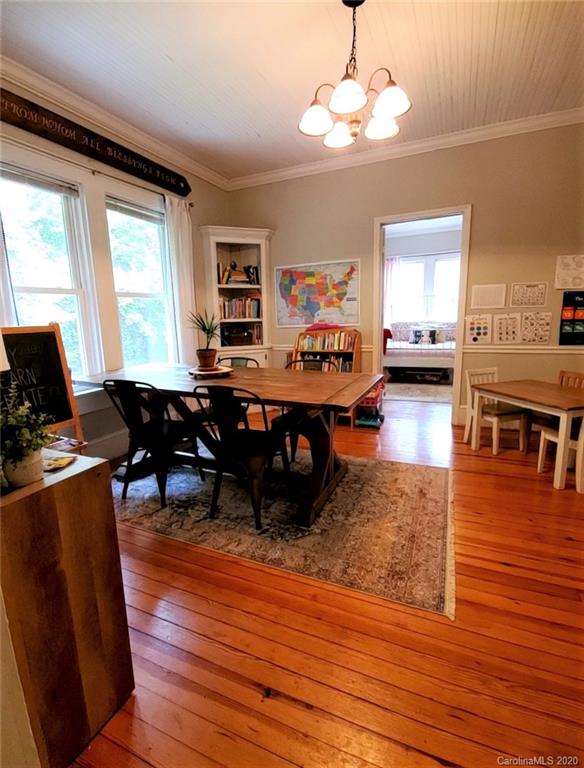 1602 Griffith Road Monroe, NC 28112 - Photo 18 of 45 a living room with furniture dining table and wooden floor