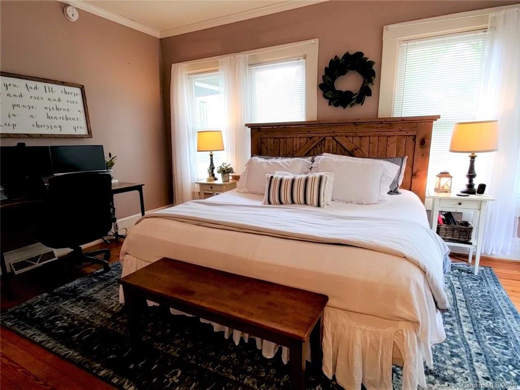 1602 Griffith Road Monroe, NC 28112 - Photo 20 of 45 a bedroom with a bed and a lamp on dresser