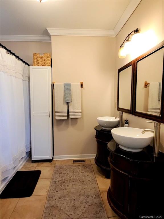 1602 Griffith Road Monroe, NC 28112 - Photo 22 of 45 a bathroom with a sink and a mirror