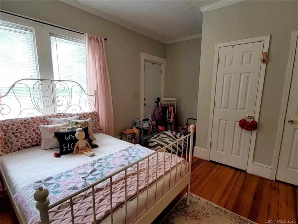 1602 Griffith Road Monroe, NC 28112 - Photo 25 of 45 a bedroom with a bed a table and chair