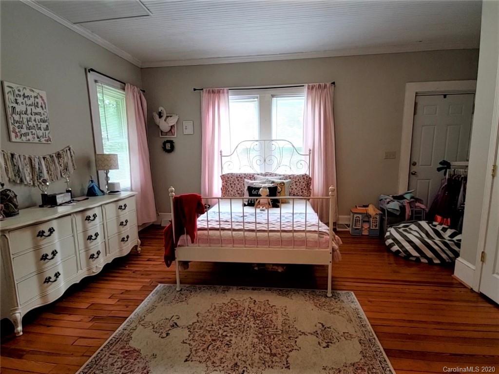 1602 Griffith Road Monroe, NC 28112 - Photo 26 of 45 a living room with furniture and a dresser