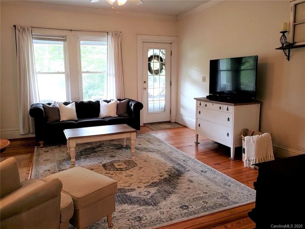 1602 Griffith Road Monroe, NC 28112 - Photo 4 of 45 a living room with furniture and a flat screen tv