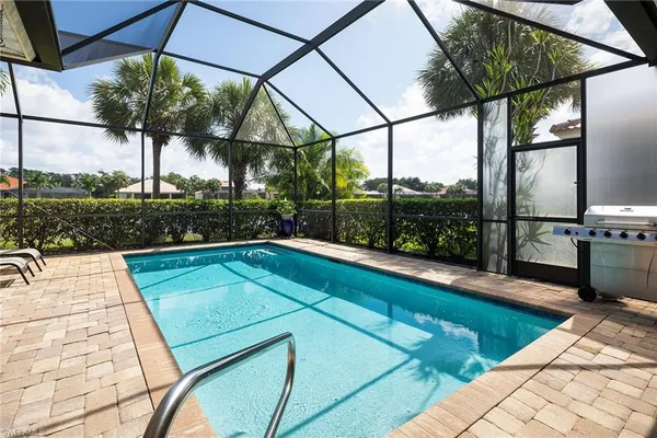 a view of swimming pool with a patio