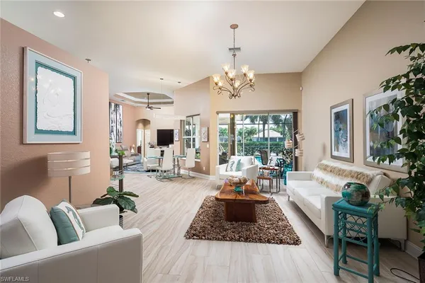 a living room with furniture or couch and a large window