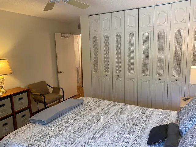 a bedroom with a bed and a table