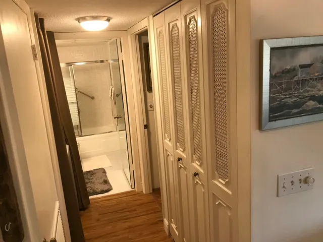 a view of a bathroom from a hallway