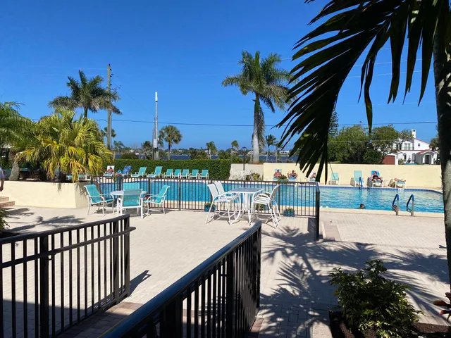 a balcony with view of palm trees