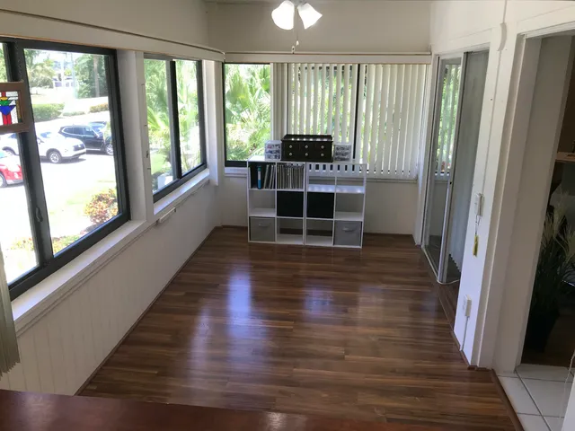 a view of a room with wooden floor and stairs