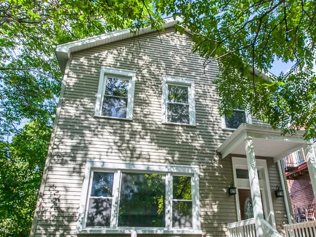 a brick house with a large windows