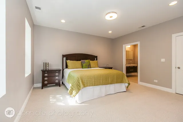 a bedroom with a bed and a walk in closet